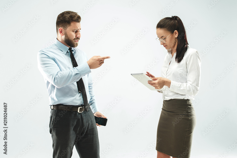 a business man shows the laptop to his colleague in the office. a business man shows the laptop to his colleague in the office.