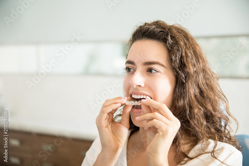 Woman Wearing Clear Aligner In Dental Clinic