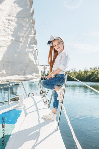 The children on board of sea yacht