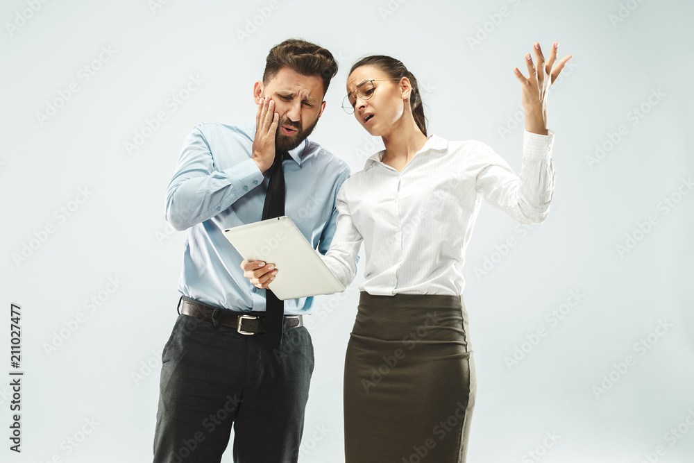 a business man shows the laptop to his colleague in the office. a business man shows the laptop to his colleague in the office.