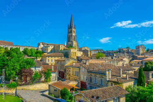 Aerial view of French village Saint Emilion dominated by spire of the monolithic church photo