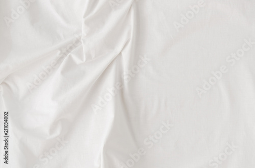 clean white linen fabric with folds, background, soft daylight, top view, close up