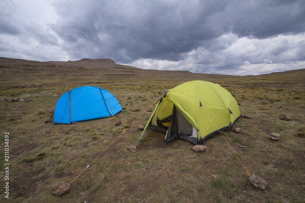 Hiking Tents under stormy sky