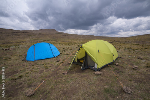 Hiking Tents under stormy sky