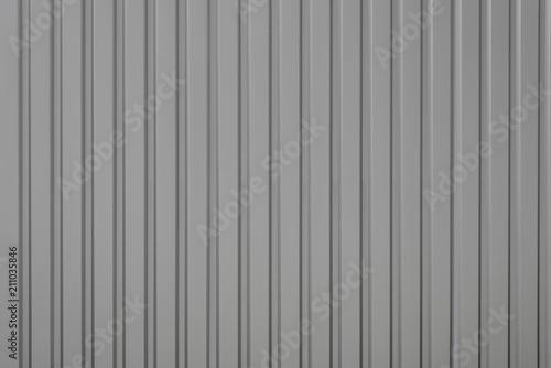 Gray relief striped stone wall, fence or roof texture