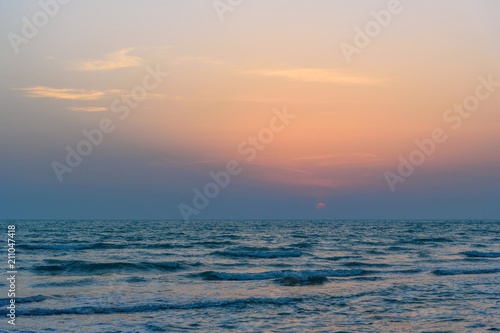 Sunset over the sea on wild beach of Persian gulf coast. Iran