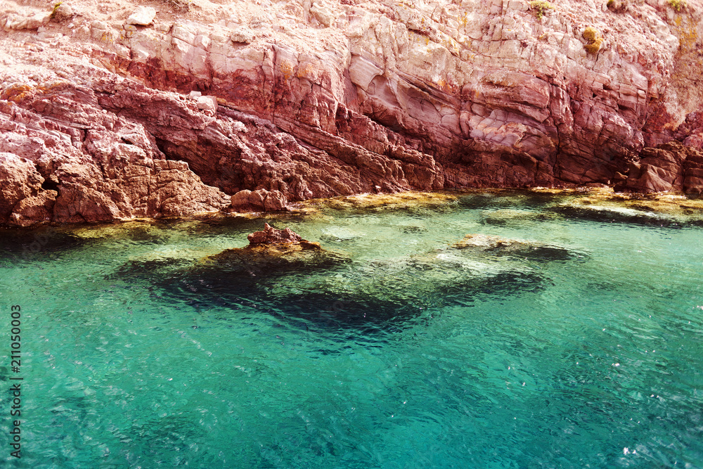 A view of a crystal clear Aegean sea and rocks in the island of Patmos, Greece