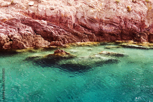 A view of a crystal clear Aegean sea and rocks in the island of Patmos, Greece