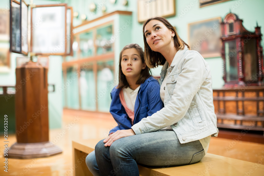 Mother and daughter exploring expositions