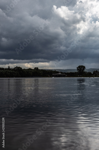Cloudy lake after rain. © Miosz