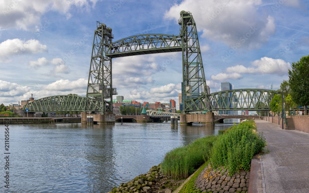 Historic iron railroad bridge in Rotterdam on a sunny morning Historic iron railroad bridge in Rotterdam on a sunny morning