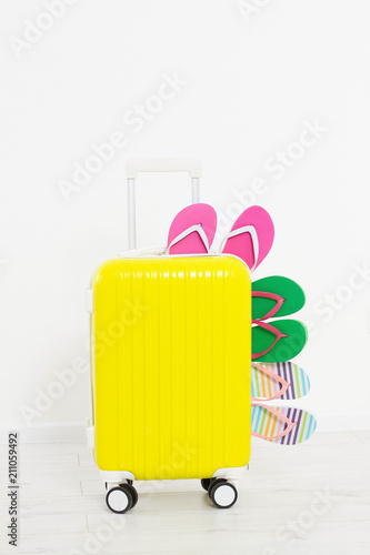 suitcase isolated on white background Summer holidays. summer flip flops or slippers.Sandals beach.Red cap.Travel valise or bag. Mock up. Copy space. Template. Blank.