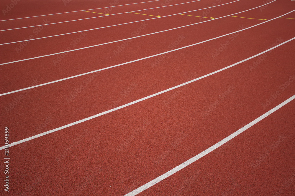 soft focus empty red running road track background texture concept with marking of white line and space for copy or text soft focus empty red running road track background texture concept with marking of white line and space for copy or text