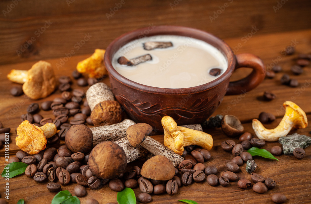 Concept of trend modern food industry. Mushroom coffee from mushrooms Chaga, a ceramic cup on a wooden background with coffee beans. Cappuccino, hipster, latte, instagram. Copy space, selective focus. Concept of trend modern food industry. Mushroom coffee from mushrooms Chaga, a ceramic cup on a wooden background with coffee beans. Cappuccino, hipster, latte, instagram. Copy space, selective focus.
