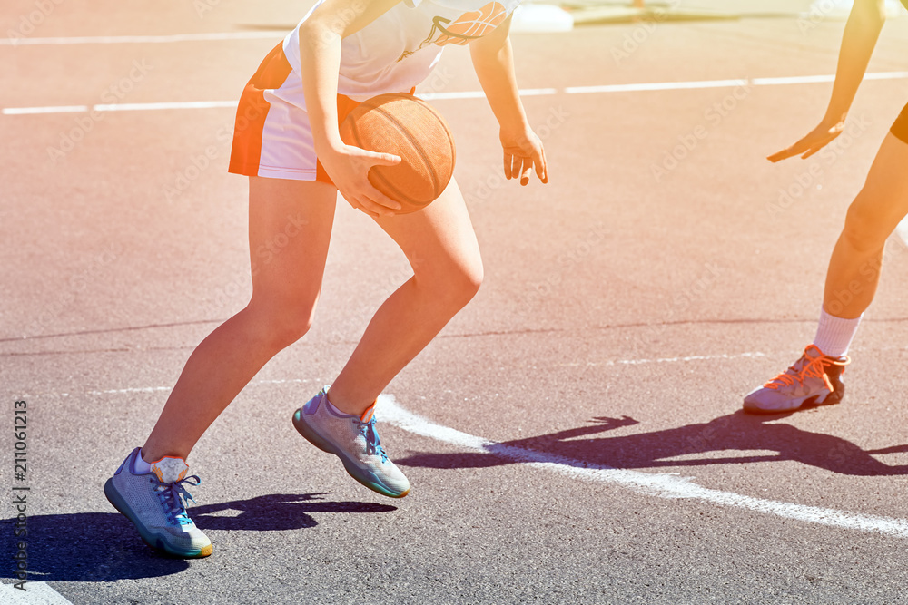Obraz premium Girls teenagers basketball player play and train on the basketball.