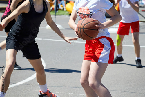 Girls teenagers basketball player play and train.