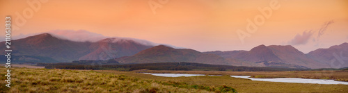 Beautiful sunset view of Connemara. Scenic Irish countryside landscape with magnificent mountains on the horizon  County Galway  Ireland.