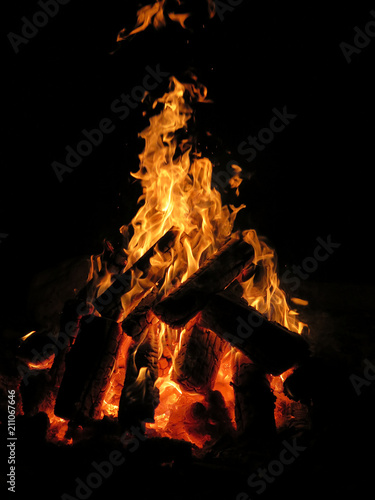 Dramatic fire flames in a campfire pit © Jitka