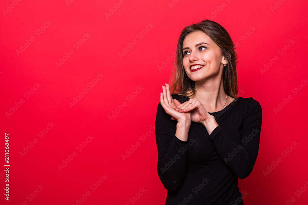 Attractive smile happy woman on color red background Attractive smile happy woman on color red background