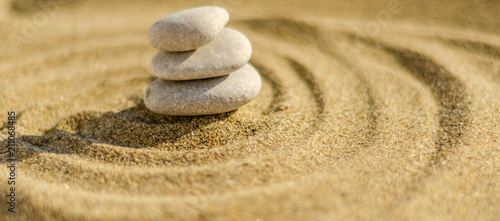Photography zen meditation stone in sand, concept for purity harmony and spirituality, spa w