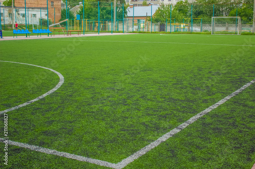artificial small football field green grass surface background texture with nobody sport concept and empty space for copy or text