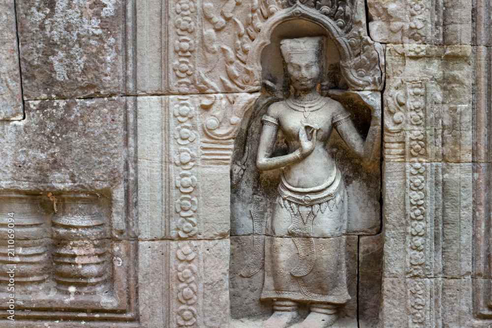 Ancient stone woman figure of Banteay Kdei temple, Angkor Wat, Cambodia. Ancient temple bas-relief.