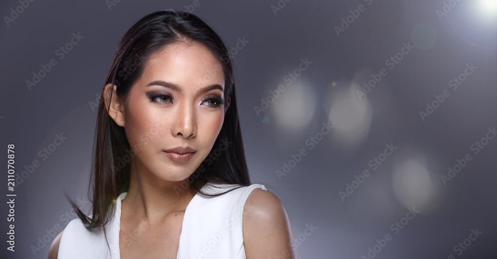 Woman looking an idea and pointing to left side copy space Woman looking an idea and pointing to left side copy space