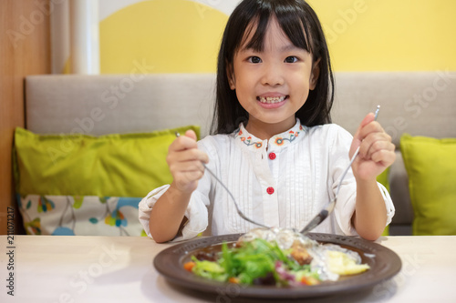 Asian Little Chinese Girl Eating Western Food