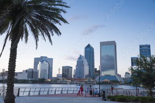 Jacksonville, FL/ USA 07/25/2017- The Jacksonville skyline can be seen across the water as evening sets in.