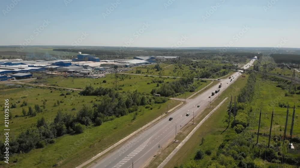 4K AERIAL SLOW MOTION CLOSE UP: Cars and trucks driving on busy highway through the desert. Freight semi trucks transporting goods, personal cars on a road trip, people traveling in sunny summer 4K AERIAL SLOW MOTION CLOSE UP: Cars and trucks driving on busy highway through the desert. Freight semi trucks transporting goods, personal cars on a road trip, people traveling in sunny summer