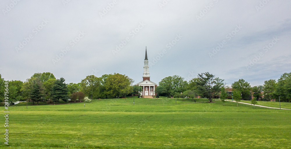 The rural church on the green field