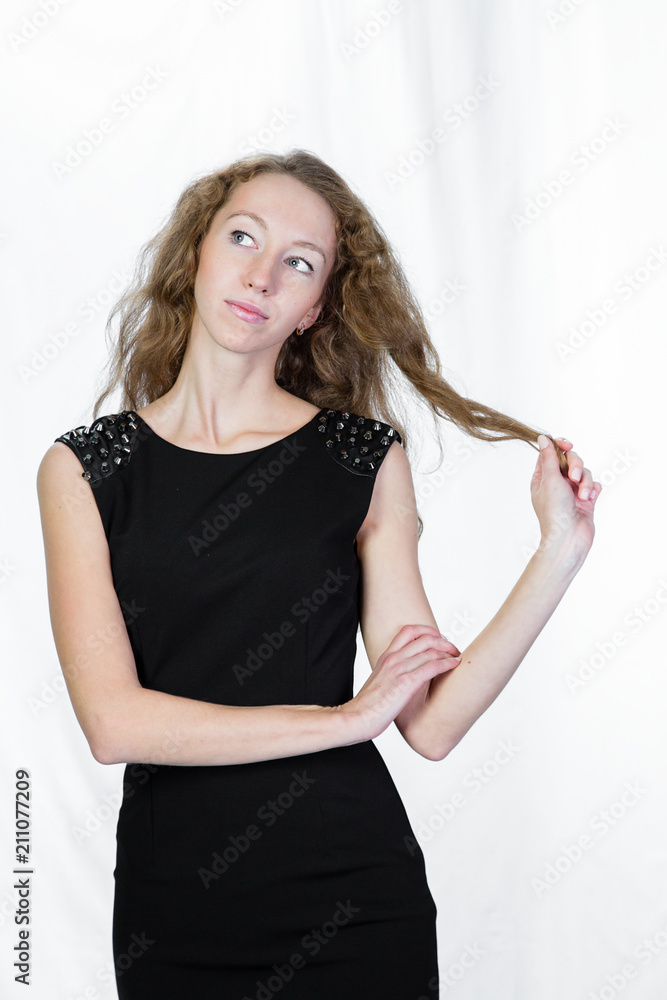 portrait of a young blond girl on a white background. portrait of a young blond girl on a white background.