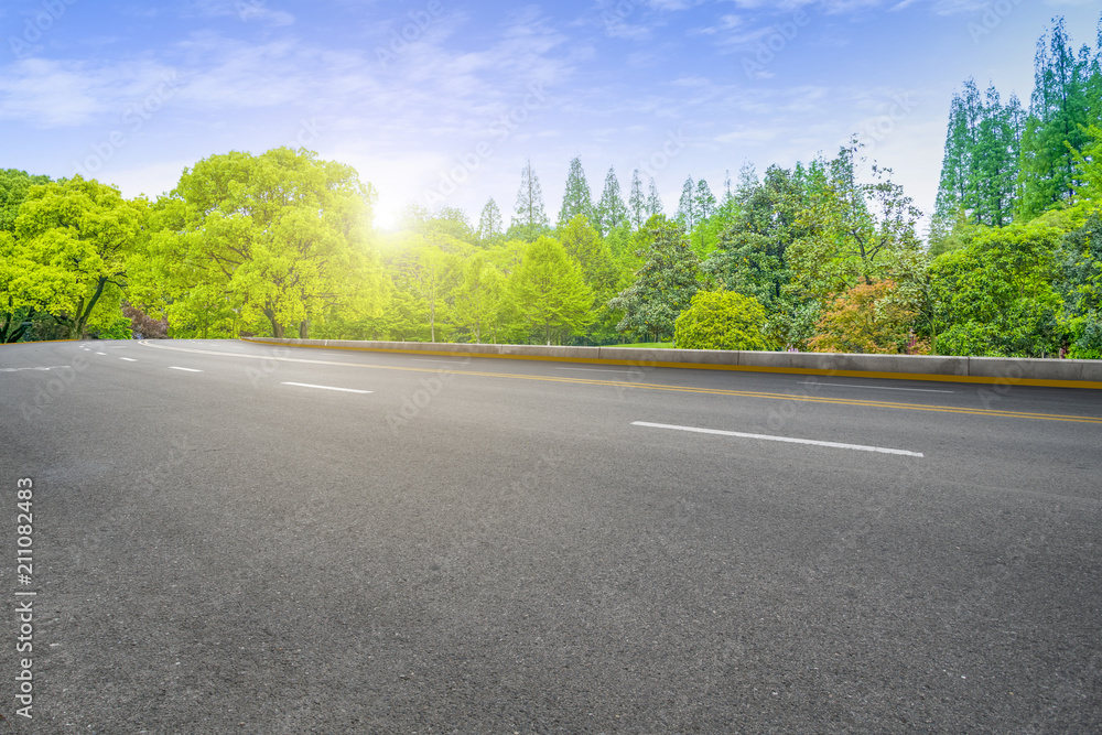 Asphalt road square and river hill under the blue sky Asphalt road square and river hill under the blue sky