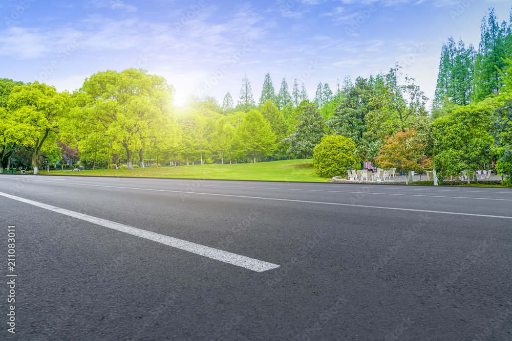 Asphalt road square and river hill under the blue sky Asphalt road square and river hill under the blue sky