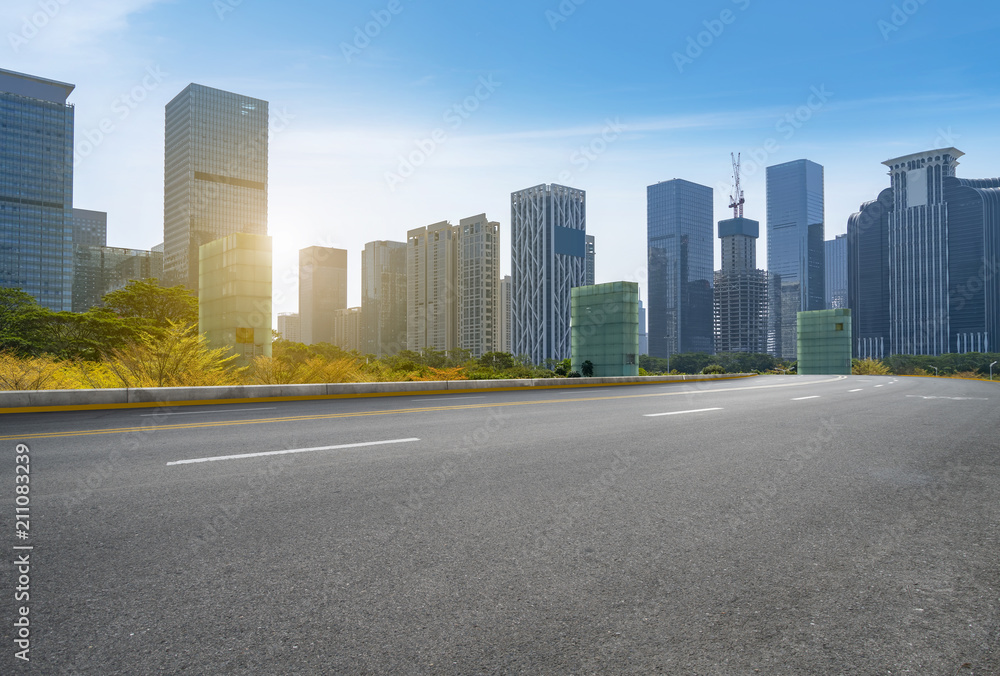 empty road with panoramic cityscape