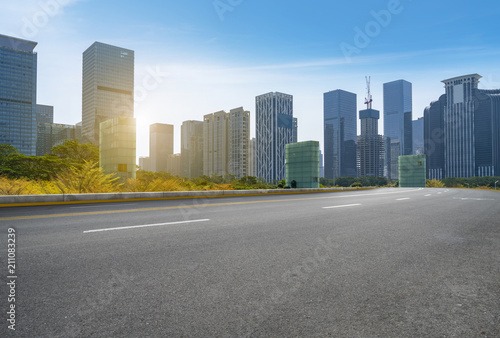 empty road with panoramic cityscape © 昊 周