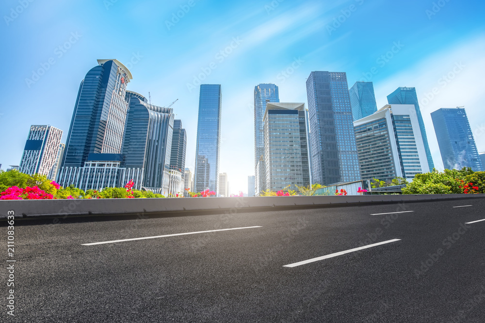 empty road with panoramic cityscape empty road with panoramic cityscape