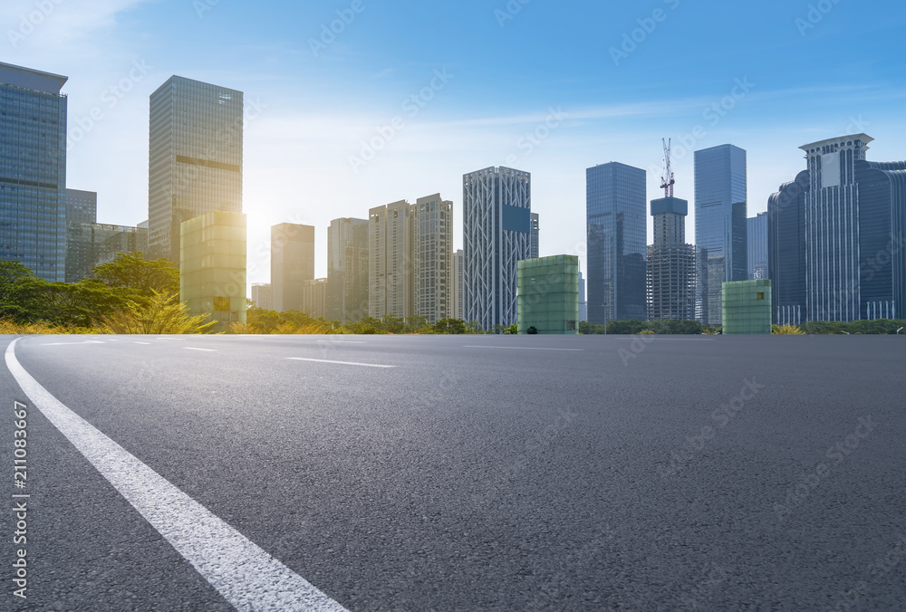 empty road with panoramic cityscape empty road with panoramic cityscape
