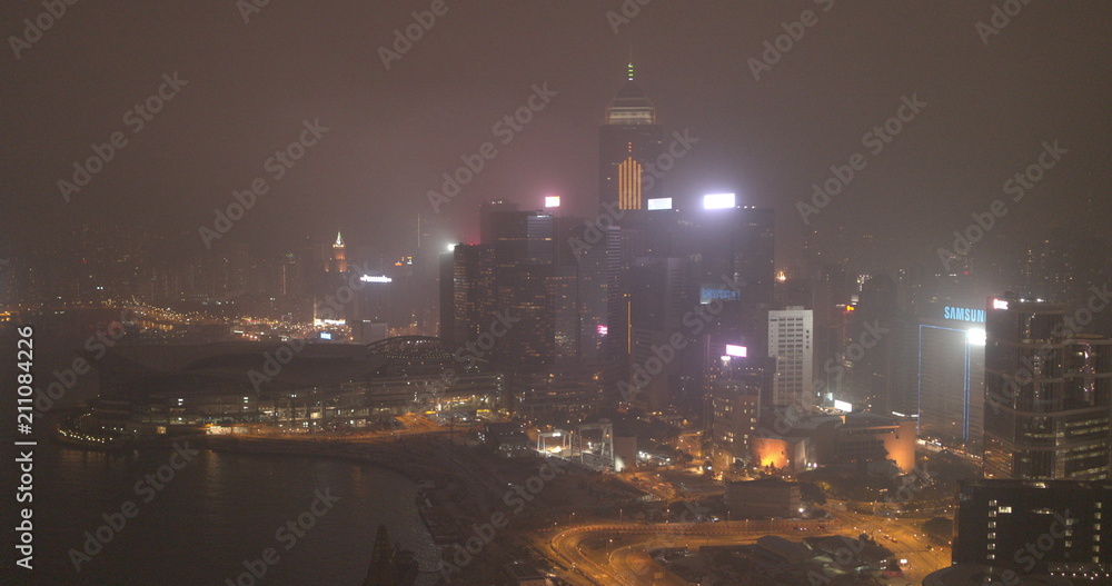 Night city, skyscrapers and buildings with lighting.