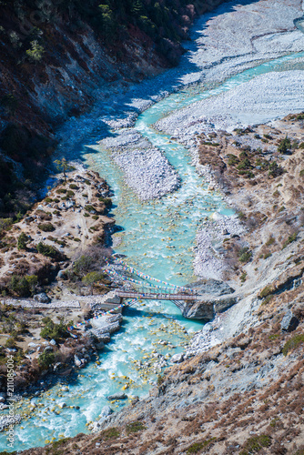 Beautiful river and mountains landscape in forest during trekking route to the Everest Base Camp