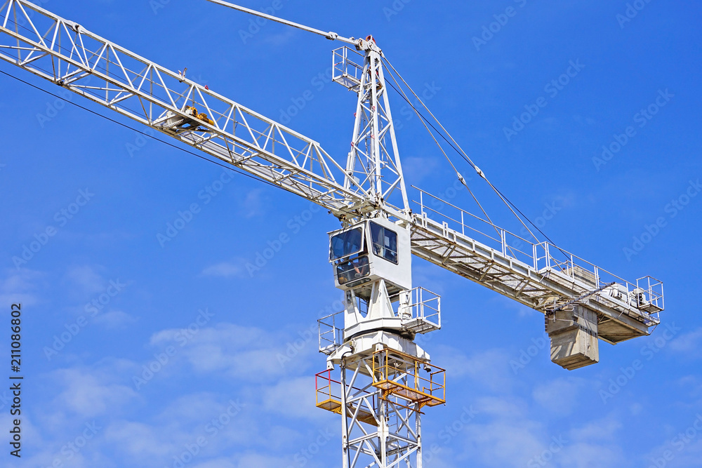 Tower crane at work in construction Tower crane at work in construction