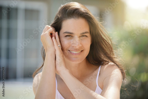 Portrait of attractive 40-year-old brunette woman