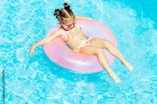 Cute and funny girl in swimming pool © paninastock