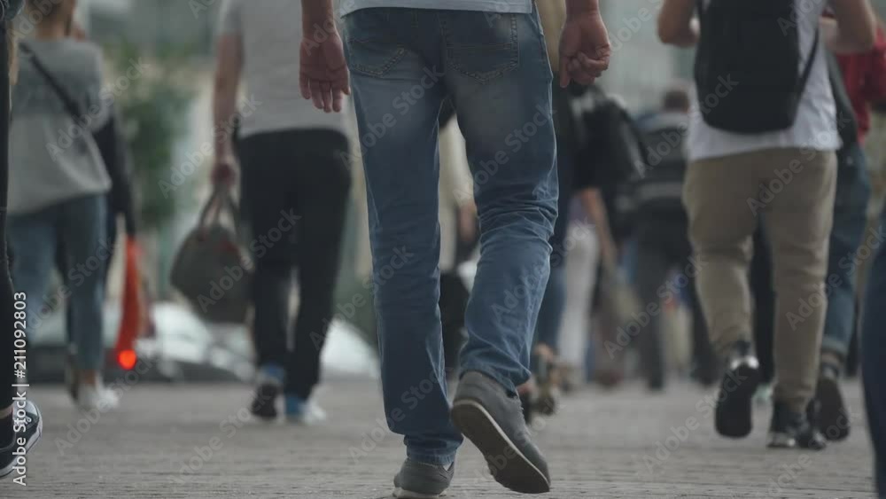 Cityscape, view of people walking along the street, crowd of people.
Cityscape, view of people walking along the street, crowd of people.
