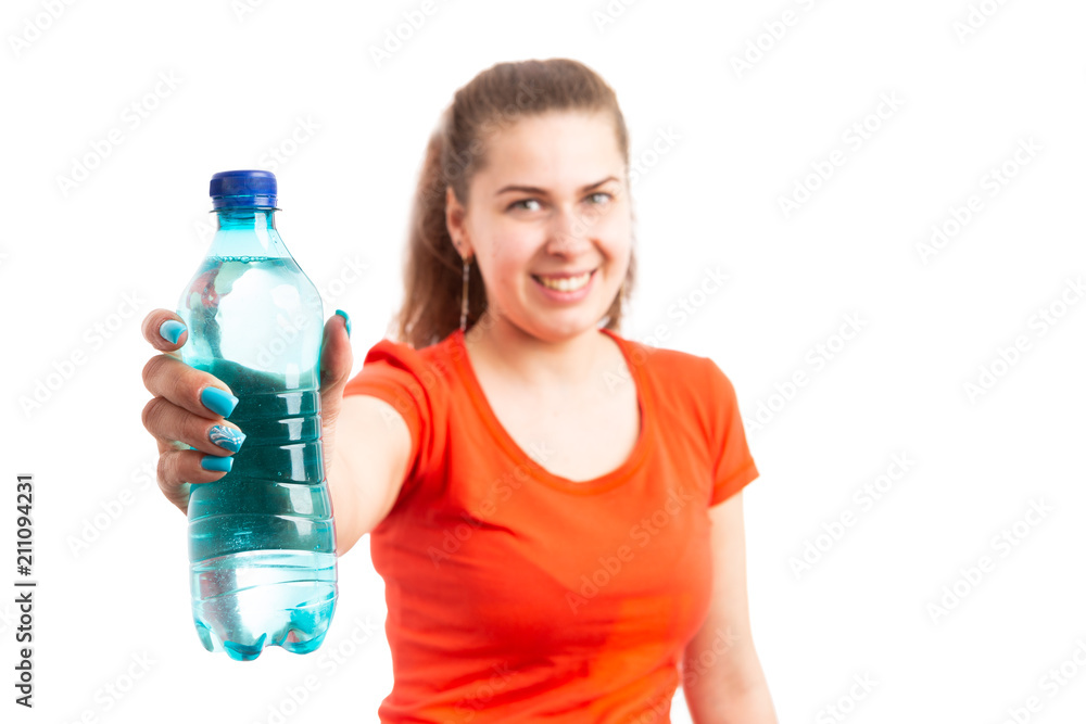 Young attractive woman offering bottle of water. Young attractive woman offering bottle of water.