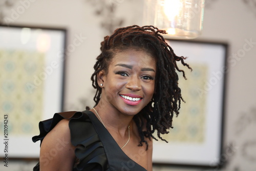 Charming happy black woman smiling at camera