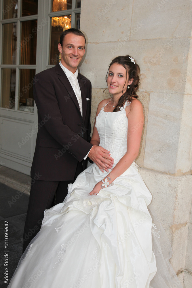 young just married couple posing in wedding day