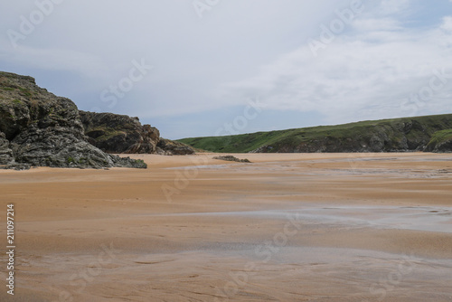 Lonely beach at Belle-Ile-en-Mer with cloudy sky, Brittany, France