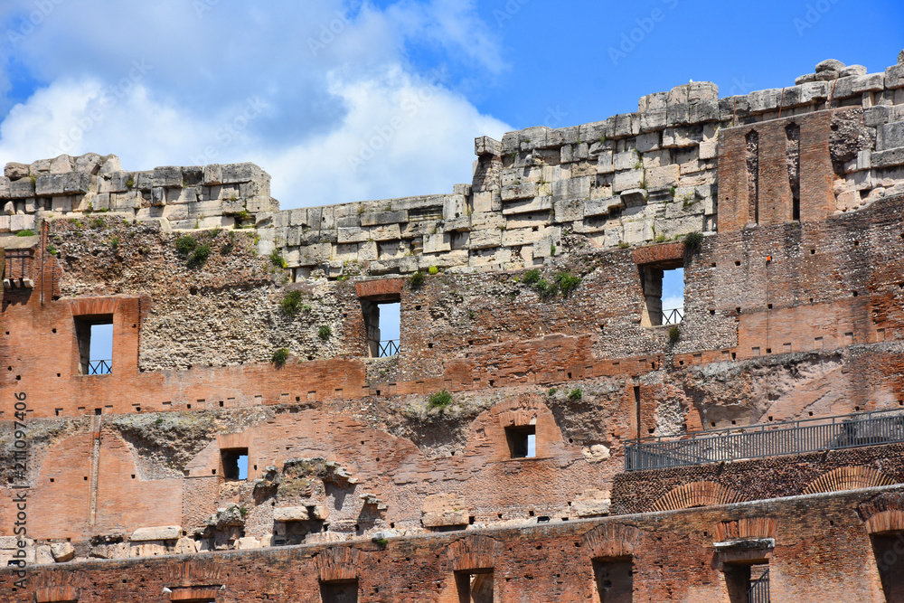 Italy, Rome, Colosseum. View of internal and external architectures. Known as the Flavian Amphitheater, it is the largest amphitheater in the world, located in the city center of Rome. Italy, Rome, Colosseum. View of internal and external architectures. Known as the Flavian Amphitheater, it is the largest amphitheater in the world, located in the city center of Rome.
