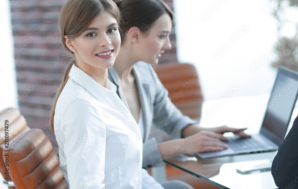 office workers sitting behind a Desk. office workers sitting behind a Desk.